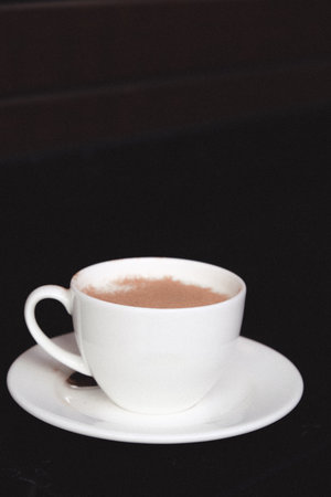 A cozy corner with a steaming cup of coffeeの写真素材