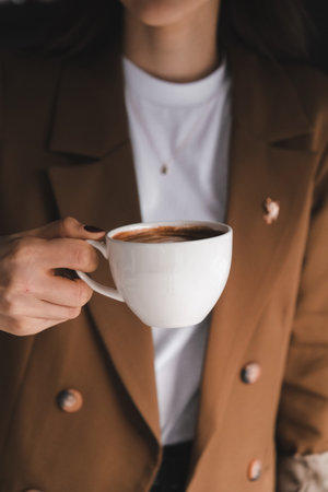 A cozy corner with a steaming cup of coffeeの写真素材