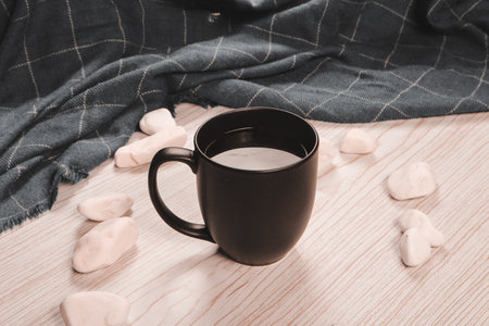 A steaming cup on the tableの写真素材