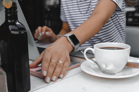 A steaming cup of coffee on the tableの写真素材