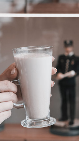 A cozy corner with a steaming cup of coffeeの写真素材