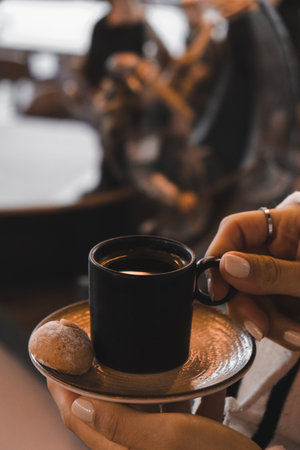 Freshly brewed coffee served in a stylish cupの写真素材