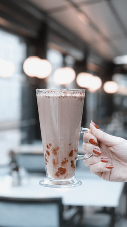 A cozy corner with a steaming cup of coffeeの写真素材