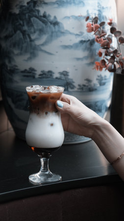 A steaming cup of coffee on the tableの写真素材