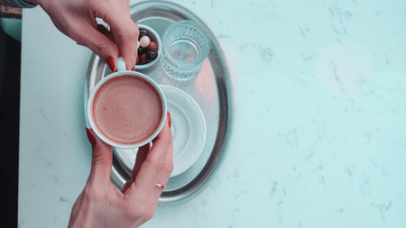 Freshly brewed coffee served in a stylish cupの写真素材