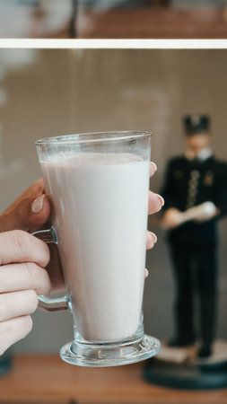 A steaming cup on the tableの写真素材