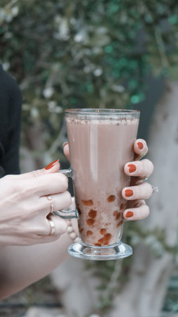 Freshly brewed coffee served in a stylish cupの写真素材