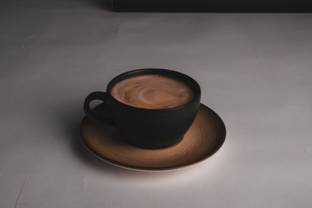 A cozy corner with a steaming cup of coffeeの写真素材