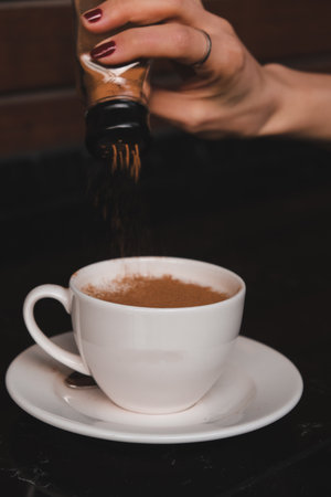 A cozy corner with a steaming cup of coffeeの写真素材