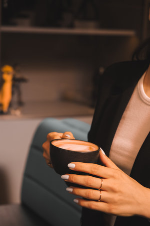 Freshly brewed coffee served in a stylish cupの写真素材