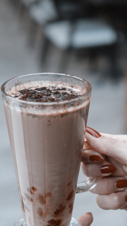 A steaming cup of coffee on the tableの写真素材