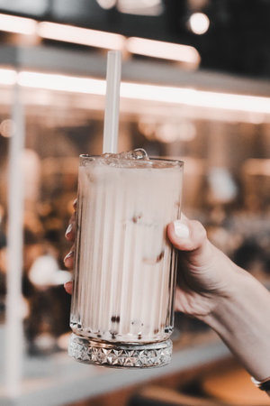 A steaming cup of coffee on the tableの写真素材