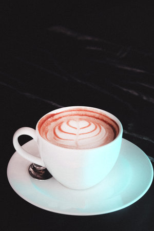 A cozy corner with a steaming cup of coffeeの写真素材