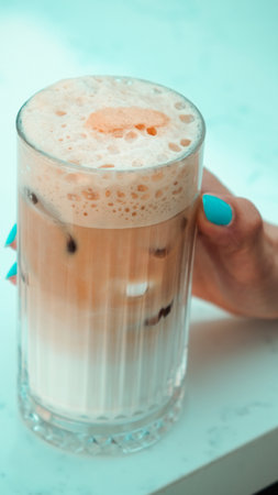 Freshly brewed coffee served in a stylish cupの写真素材