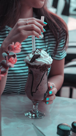 Freshly brewed coffee served in a stylish cupの写真素材