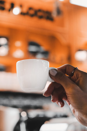 Freshly brewed coffee served in a stylish cupの写真素材