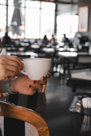 Freshly brewed coffee served in a stylish cupの写真素材