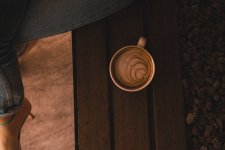 A cozy corner with a steaming cup of coffeeの写真素材