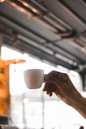 Freshly brewed coffee served in a stylish cupの写真素材