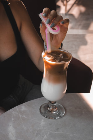 A steaming cup of coffee on the tableの写真素材