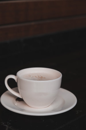 Freshly brewed coffee served in a stylish cupの写真素材