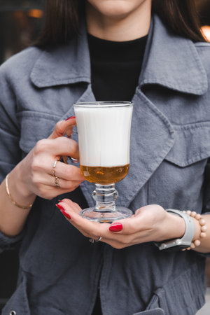 A steaming cup of coffee on the tableの写真素材