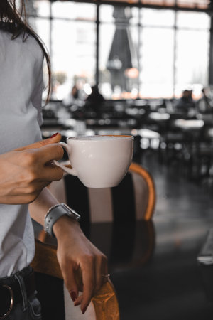 A cozy corner with a steaming cup of coffeeの写真素材