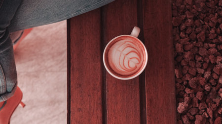 A cozy corner with a steaming cup of coffeeの写真素材