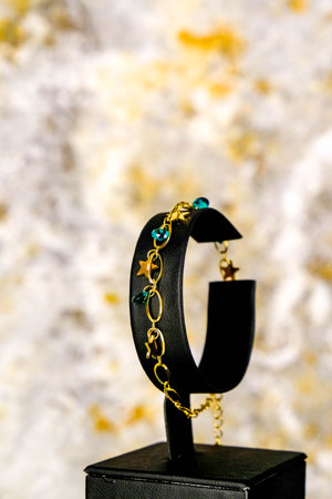 Beautiful golden jewelery with precious stonesの写真素材