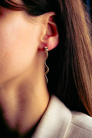 gold snake earringの写真素材