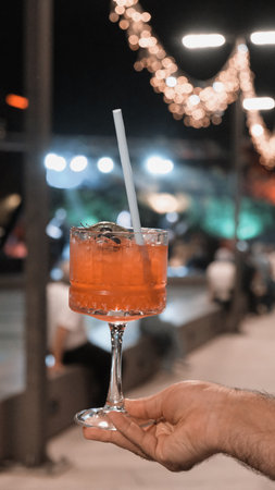 Cocktail glasses filled with vibrant, colorful drinksの写真素材