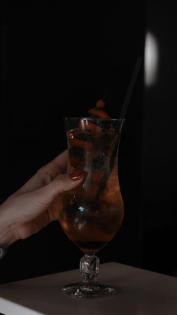 Cocktail glasses filled with vibrant, colorful drinksの写真素材