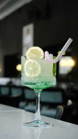 Cocktail glasses filled with vibrant, colorful drinksの写真素材