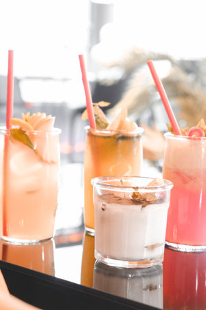 Colorful cocktails served in elegant glassesの写真素材