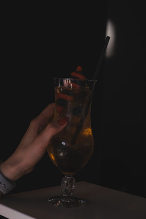 Cocktail glasses filled with vibrant, colorful drinksの写真素材