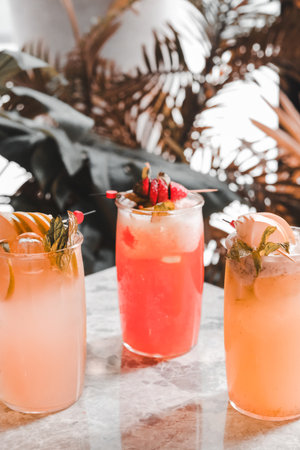 Colorful cocktails served in elegant glassesの写真素材