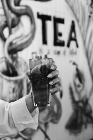 Cocktail glasses filled with vibrant, colorful drinksの写真素材