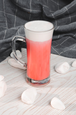 Glass filled with vibrant, colorful drinkの写真素材