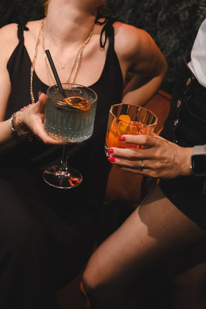 Cocktail glasses filled with vibrant, colorful drinksの写真素材