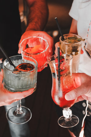 Cocktail glasses filled with vibrant, colorful drinksの写真素材