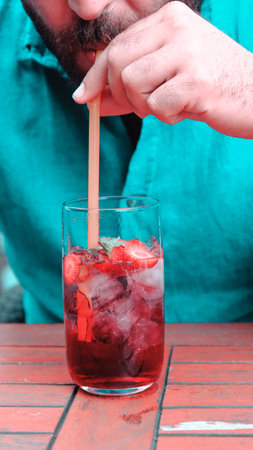 Cocktail glasses filled with vibrant, colorful drinksの写真素材