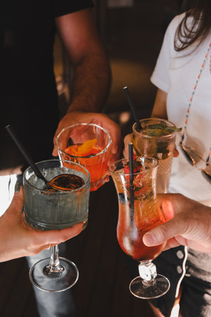 Cocktail glasses filled with vibrant, colorful drinksの写真素材