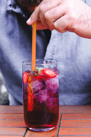 Cocktail glasses filled with vibrant, colorful drinksの写真素材