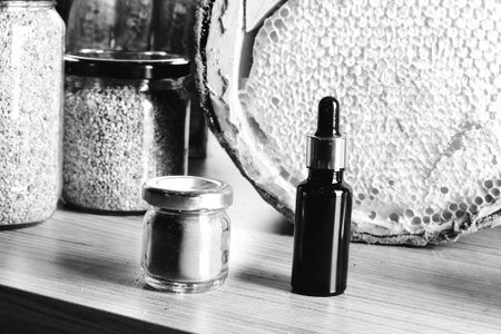 honeycomb and honey on the tableの写真素材