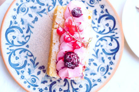 Colorful Fruit Topped Cake on White Background