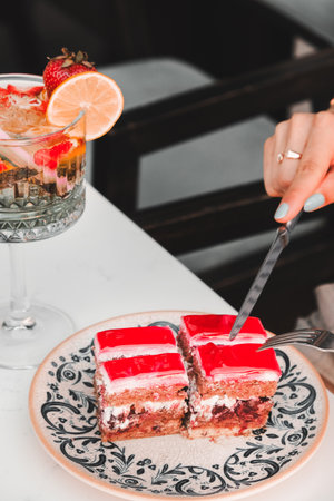 Colorful Fruit Topped Cake on White Backgroundの写真素材