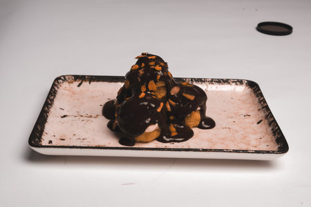 Colorful Fruit Topped Cake on White Backgroundの写真素材