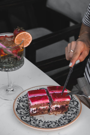 Elegant Layered Cake on a Rustic Wooden Tableの写真素材