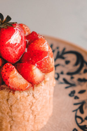 Colorful Fruit Topped Cake on White Backgroundの写真素材