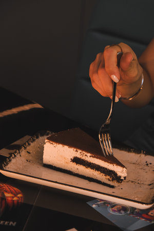 Elegant Layered Cake on a Rustic Wooden Tableの写真素材